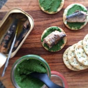 Sardines on crackers with nettle-walnut butter